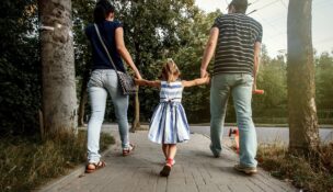 Couple walking with young child